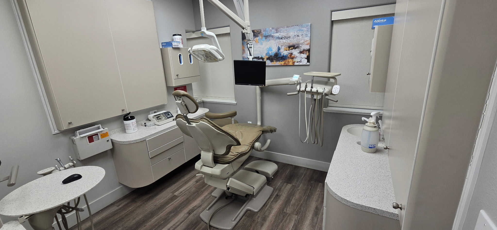 Modern Eastern Oregon dental operatory with A-dec chair, integrated monitor, updated cabinetry, and contemporary finishes